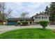 Charming home featuring a well-manicured lawn and an attached two-car garage, great curb appeal at 11310 W Center Ave, Lakewood, CO 80226