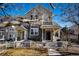 Charming two-story home with a welcoming front porch and fenced yard, perfect for outdoor enjoyment at 1461 Red Cliff Way, Castle Rock, CO 80109