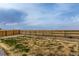 Large, fenced backyard with sprawling views of surrounding plains and farmland at 17786 Olive St, Broomfield, CO 80023