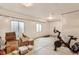 Spacious unfinished basement with a pellet bike, exposed ceiling, and natural light at 17786 Olive St, Broomfield, CO 80023