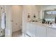 Bathroom featuring double vanity, marble countertop, and a shower-tub combination at 17786 Olive St, Broomfield, CO 80023