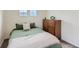 Bedroom with a cozy bed, neutral decor, and a side table for a restful retreat at 17786 Olive St, Broomfield, CO 80023