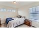 Bedroom with a cozy bed, neutral decor, and a side table, creating a restful space at 17786 Olive St, Broomfield, CO 80023