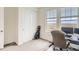 Bright bedroom with a closet, a large window with scenic views, and a modern desk setup, perfect for work or study at 17786 Olive St, Broomfield, CO 80023