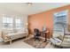 Bright home office with a cozy daybed, stylish chair, and modern desk setup, perfect for productivity and relaxation at 17786 Olive St, Broomfield, CO 80023