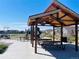 Community playground offers covered picnic area, modern benches and outdoor play equipment at 17786 Olive St, Broomfield, CO 80023