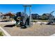 Outdoor community playground with climbing stairs and slide, surrounded by green space and neighborhood at 17786 Olive St, Broomfield, CO 80023