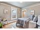 Cozy bedroom with a gray color scheme, hardwood floors, and a comfortable chair at 3647 Jason St, Denver, CO 80211