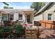 Charming single-story home featuring a cozy front porch and landscaped garden with a decorative fence at 3647 Jason St, Denver, CO 80211