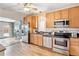 Well-equipped kitchen featuring stainless steel appliances and wooden cabinets at 3647 Jason St, Denver, CO 80211