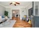 Inviting living room with hardwood floors, open layout, and a ceiling fan at 3647 Jason St, Denver, CO 80211