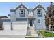 Charming two-story home with a two-car garage, modern siding, and a welcoming entryway at 16565 Black Rose Cir, Parker, CO 80134