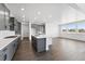 Kitchen featuring grey cabinets, quartz countertops, stainless appliances and natural light at 16565 Black Rose Cir, Parker, CO 80134