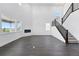 Bright and spacious living room featuring hardwood floors, a modern fireplace, and a staircase at 16565 Black Rose Cir, Parker, CO 80134