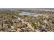 Wide aerial shot of the neighborhood, highlighting the surrounding green space, lake and homes at 2517 W 44Th Ave, Denver, CO 80211