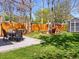 Landscaped backyard featuring a patio with a dining table, a firepit with Adirondack chairs, and a storage shed at 2517 W 44Th Ave, Denver, CO 80211