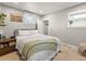 Comfortable bedroom with a cozy bed, soft bedding, and natural light creating a relaxing space at 2517 W 44Th Ave, Denver, CO 80211