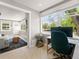Bright home office featuring a desk, modern chair, and a large window with views of the outdoors at 2517 W 44Th Ave, Denver, CO 80211