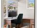 Cozy home office with large windows, a work desk, and comfortable seating with an inviting atmosphere at 2517 W 44Th Ave, Denver, CO 80211