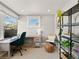 Inviting home office features desk, chair, decor, and a large window providing natural light at 2517 W 44Th Ave, Denver, CO 80211