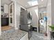 Efficient laundry area with stacked washer/dryer and unique tile flooring adding a touch of style at 2517 W 44Th Ave, Denver, CO 80211