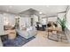 An open-concept living space with modern design elements, a comfortable seating area, and a breakfast bar at 2517 W 44Th Ave, Denver, CO 80211