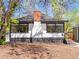 Backside view of a lovely home featuring a brick chimney and an accessible entryway at 2517 W 44Th Ave, Denver, CO 80211