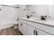 Bathroom featuring double sinks, quartz countertops, and a tub shower combo at 25076 E 41St Ave, Aurora, CO 80019