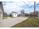 Spacious backyard with shed, expansive driveway, and secure fencing, perfect for outdoor activities at 124 3Rd St, Fort Lupton, CO 80621