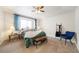 Serene bedroom with a large window, cozy bedding, and stylish decor to create a relaxing retreat at 124 3Rd St, Fort Lupton, CO 80621