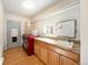 Practical laundry room features ample storage, a sink, and modern appliances for convenient chores at 124 3Rd St, Fort Lupton, CO 80621