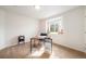 Office space with large window, desk, chair, and a stylish arrangement of decor at 124 3Rd St, Fort Lupton, CO 80621