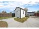 A charming storage shed, complemented by a spacious driveway and fenced yard at 124 3Rd St, Fort Lupton, CO 80621