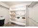 Spacious walk-in closet with built-in shelving, offering ample storage for clothing and accessories at 124 3Rd St, Fort Lupton, CO 80621