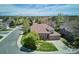 Stunning aerial view of a brick home with a lush green lawn in a beautiful neighborhood at 9524 E Caley Cir, Englewood, CO 80111