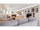 Open layout basement with a pool table, wet bar, entertainment area, and comfortable seating at 9524 E Caley Cir, Englewood, CO 80111