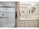 Bright bathroom featuring a shower and vanity with lots of counter space and storage at 9524 E Caley Cir, Englewood, CO 80111