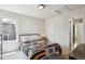 Cozy bedroom with white walls, and a quilt on the bed at 9524 E Caley Cir, Englewood, CO 80111