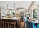 Bright, modern kitchen with stainless steel appliances, an island, and a cozy breakfast nook at 9524 E Caley Cir, Englewood, CO 80111