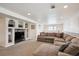 Spacious living room with built-in shelving and plenty of natural light; perfect for relaxation at 9524 E Caley Cir, Englewood, CO 80111