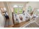 Spacious living room with high ceilings, large windows, and stylish furniture at 9524 E Caley Cir, Englewood, CO 80111