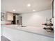 Wet bar area featuring modern appliances, plenty of counter space, and stylish wine rack at 9524 E Caley Cir, Englewood, CO 80111