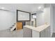 Finished basement area featuring dry bar, whiteboard, and stairway at 8732 W Arbor Ave, Littleton, CO 80123
