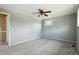 Bedroom featuring carpet flooring, ceiling fan, and ample space at 8732 W Arbor Ave, Littleton, CO 80123