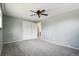 Bedroom featuring carpet flooring, ceiling fan, and closet space at 8732 W Arbor Ave, Littleton, CO 80123