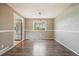 Bright dining room with hardwood floors, neutral paint, and window with natural light at 8732 W Arbor Ave, Littleton, CO 80123