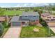 Charming two-story home with a well-maintained lawn, attached garage, and beautiful mountain views at 8732 W Arbor Ave, Littleton, CO 80123