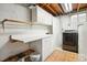 Clean laundry room with white cabinets, countertop, and modern washer and dryer units at 8732 W Arbor Ave, Littleton, CO 80123