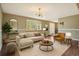 Cozy living room with natural light, stylish furnishings, and hardwood floors at 8732 W Arbor Ave, Littleton, CO 80123