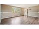 Spacious living room with hardwood floors, large window, and neutral decor at 8732 W Arbor Ave, Littleton, CO 80123